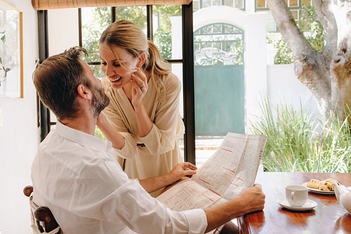 Couple flirting at a tea table in a hotel