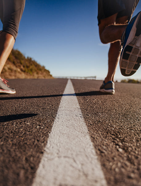 Runners on middle of the road