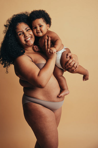 Plus size mother with her baby