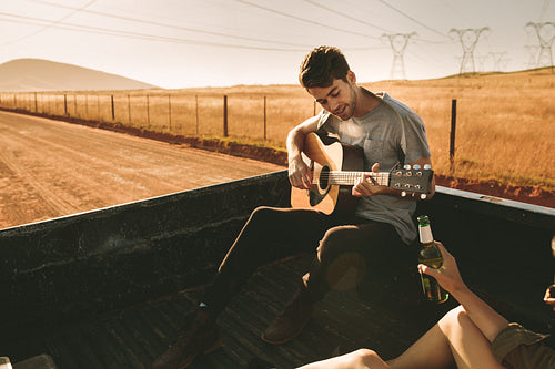 Couple enjoying on a road trip in their car