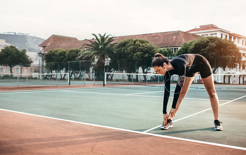 Young healthy girl doing stretching exercises