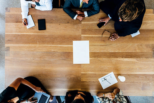 Team of business people around the table meeting