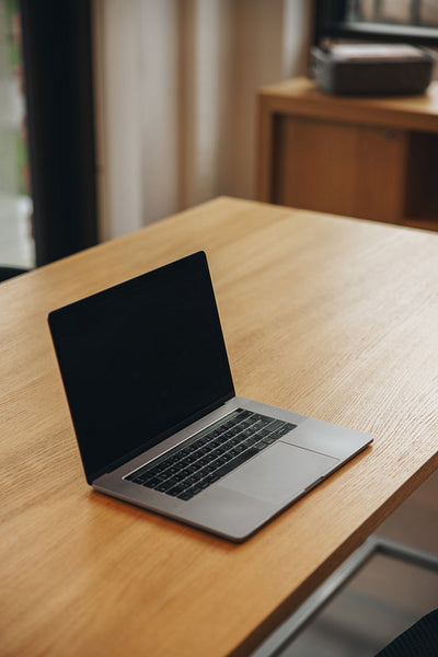 Laptop with black screen in business meeting room