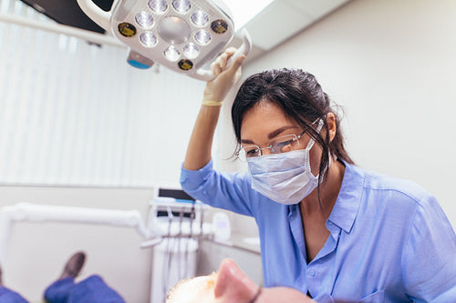 Dentist examining patient teeth