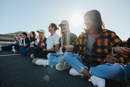 Group of young activists uniting in peaceful protest outdoors during sunny day