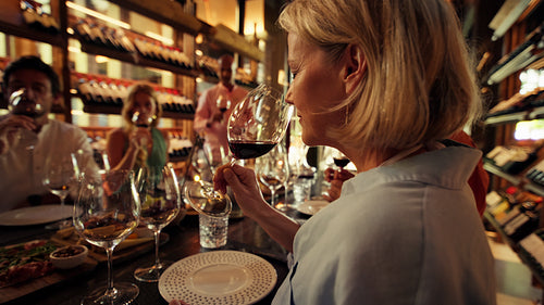 Enjoying a luxurious private wine tasting experience with friends in an exclusive room