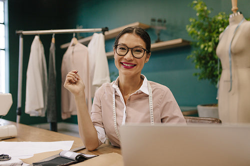 Asian woman working in a fashion studio