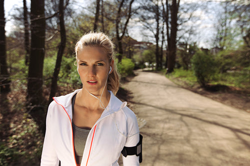 Fit young female runner of forest trail