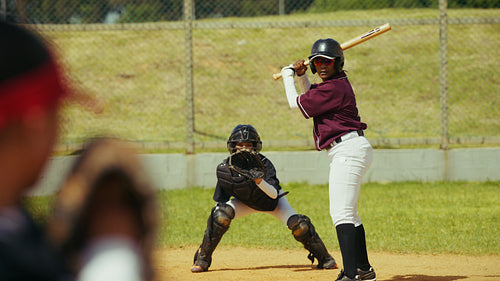 Batter hits a powerful ball during a baseball game