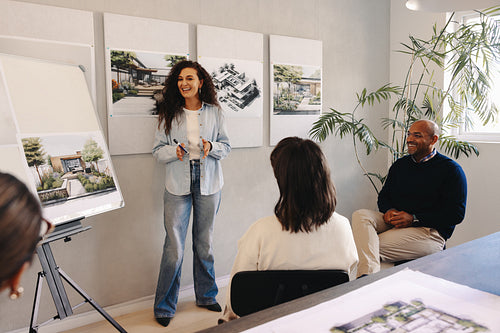 Team planning session discussing project strategies with visual aids and teamwork