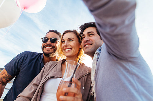 Young people partying together and taking selfie