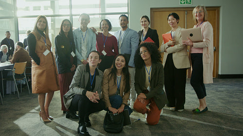 Business professionals posing at conference