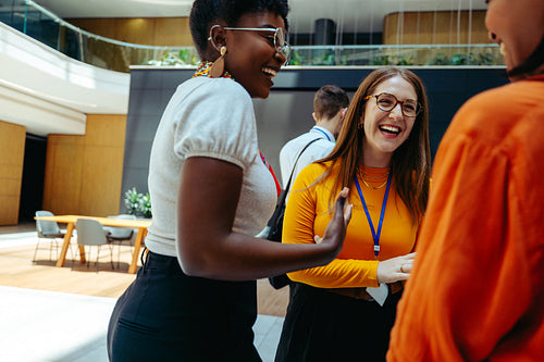 Female professionals engage in lively discussions showcasing empowerment within the finance industry