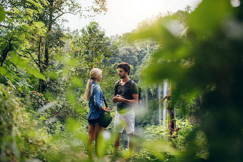 Couple of hikers together in forest