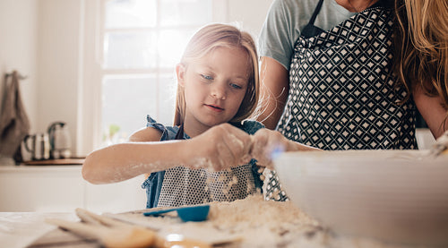 Little girl learning to cook