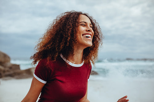 African woman enjoying at the beach