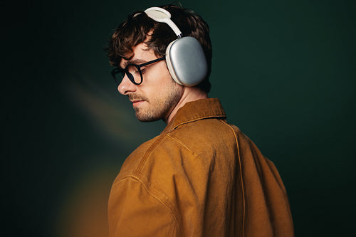 Exploring music through style and technology with headphones and glasses