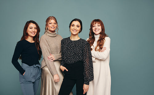 Women of different ages smiling in a studio