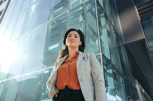 Self-confident businesswoman looking at the camera outside her workplace