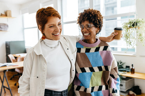 Colleagues in a modern co-working space sharing ideas