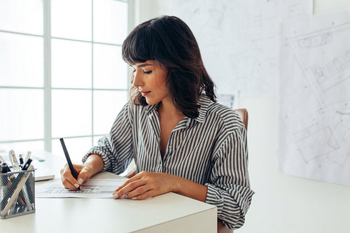 Female architect making her designs