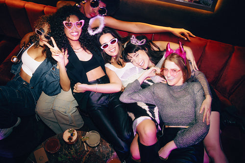 Friends enjoying a fun night out at a stylish club atmosphere