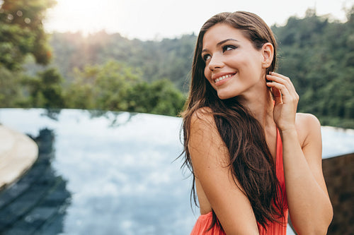 Beautiful young woman looking away and smiling.