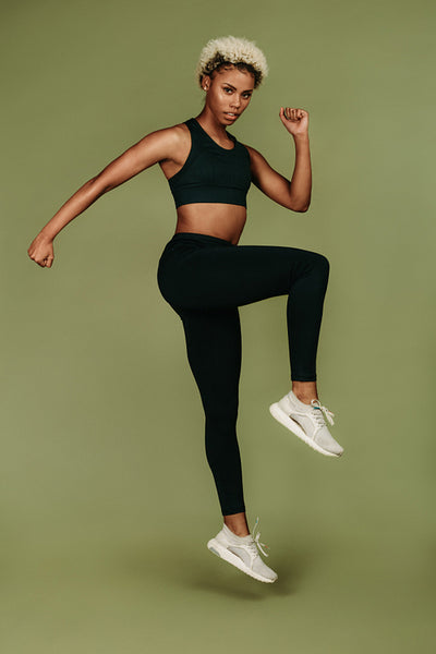 Portrait of woman athlete doing fitness exercise