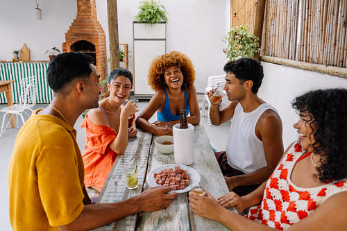 Group of five friends enjoying a weekend gathering in Rio de Janeiro