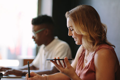 Business couple sitting at coffee shop and working