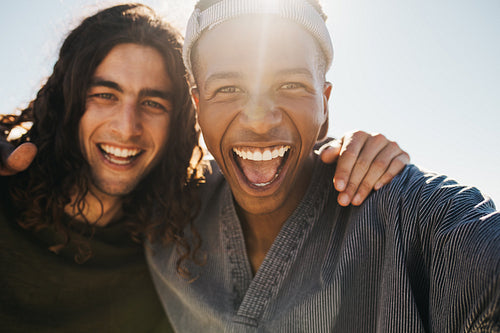 Excited two young men making a selfie