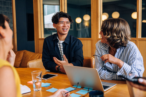 Young professionals discussing ideas during a casual business meeting in a modern office
