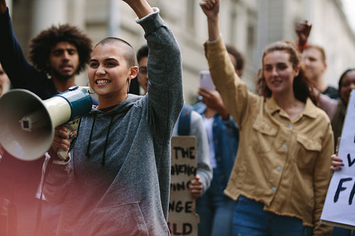 Woman with megaphone during street protest