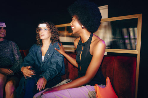 Group of friends enjoying a fun game night in a modern setting