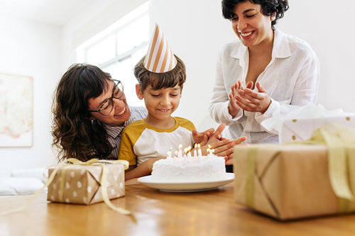 Parents celebrating boy's birthday at home