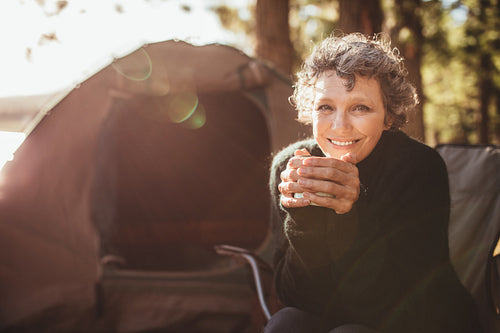 Smiling mature couple on camping