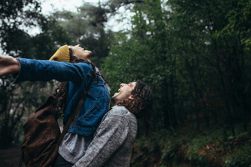 Romantic couple enjoying the rain