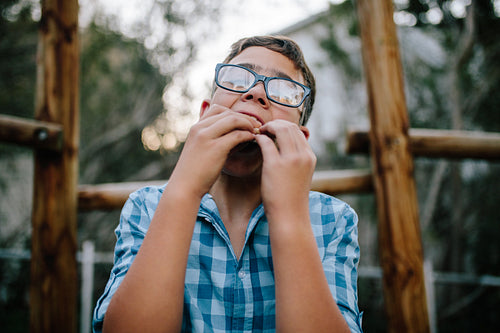 Portrait of a boy eating sandwich
