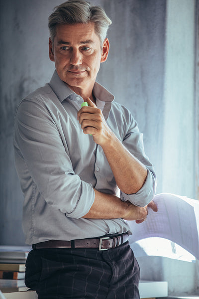 Thoughtful mature businessman at office