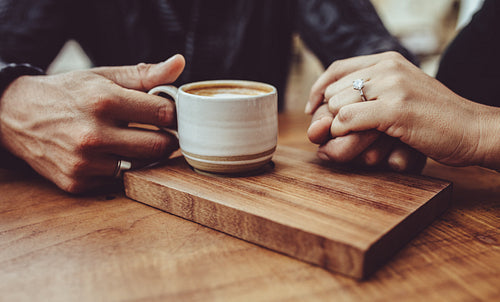 Loving couple sitting together at coffee shop