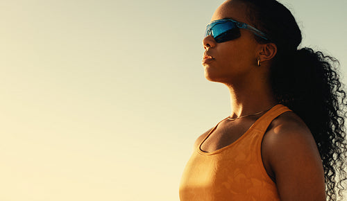 Pro brazilian athlete in sunset volleyball match on coastal beach
