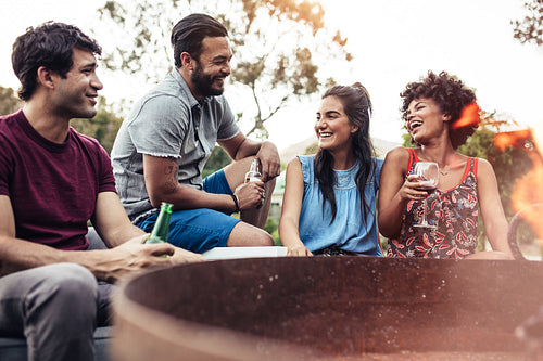 Young people partying together in backyard
