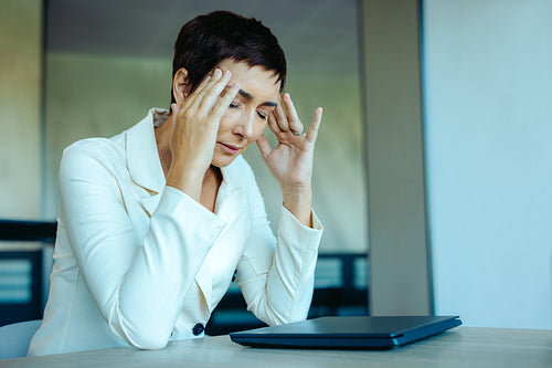 Stressed executive feels pressure during a busy workday
