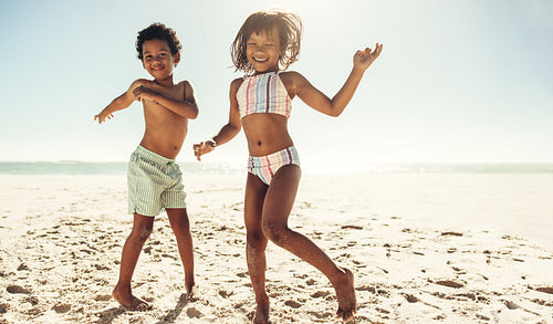 Dancing and having fun on beach sand