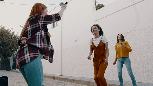 Girls playing jump rope games outdoors