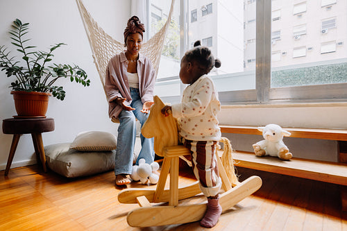 Mother and child play in cozy home