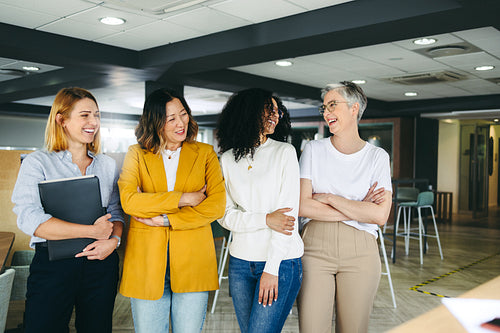 Multicultural businesswomen standing in a co-working office