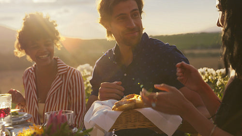 Friends having dinner together at party