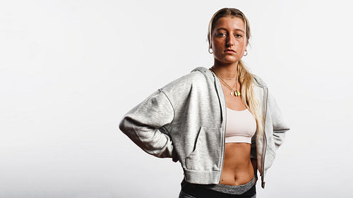 Athletic woman standing in workout clothes