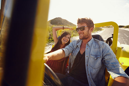 Young man with his beautiful girlfriend on a road trip